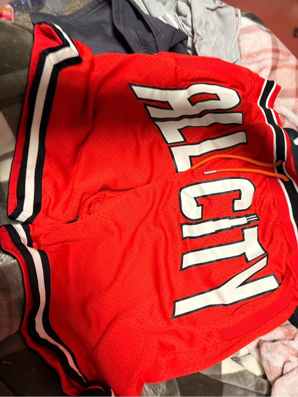 Men's Red Athletic Mesh Shorts with Bold White Contrast Lettering